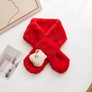 Detail of red plush baby scarf featuring a cute 3D cartoon animal head and soft texture