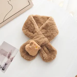 Close-up of plush khaki scarf featuring high-density faux fur texture and a cute 3D bear