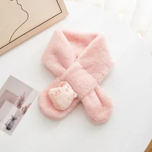 Close-up of pink plush scarf for kids with a cute cartoon cat decoration and cross-tuck