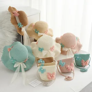 Kids summer straw hat and matching bag set with butterfly lace and wave brim detail