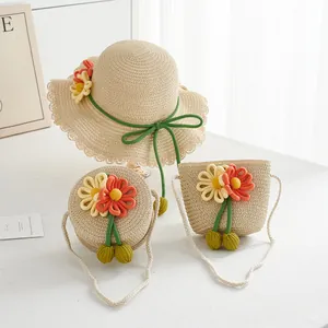Detail of summer straw hat and matching bags with handmade floral knit decorations
