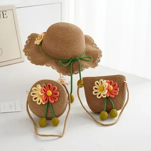 Detail of children's straw hat and crossbody bags with vibrant knitted flower accents