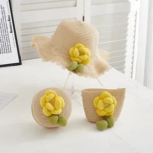 Three-piece straw hat and bag set with yellow camellia flowers for beach summer style