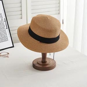 Brown wide brim straw boater hat with black ribbon for summer sun protection