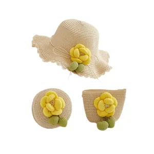 Kids summer straw sun hat and matching woven bag set with yellow floral decoration