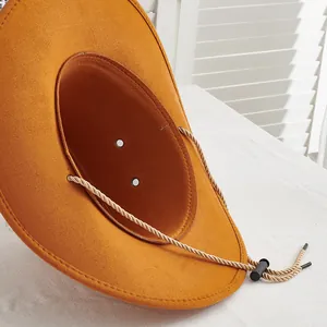 Close-up of orange wool western cowboy hat with adjustable chin strap and vent details