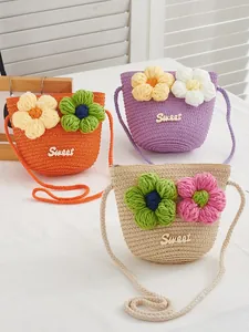 Three colorful woven straw crossbody bags for girls with sweet floral decorations