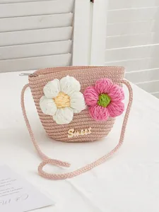 Pink woven straw crossbody bag for girls with 3D crochet flowers and Sweet logo