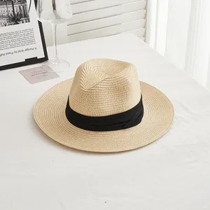 Detailed view of the finely woven straw texture and black band of this Panama sun hat