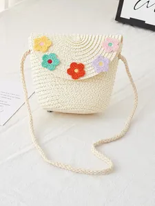 Handwoven cream straw crossbody bag for girls with colorful crochet floral decorations