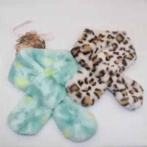 Detail view of tie-dye and leopard faux fur scarves with soft plush texture for kids