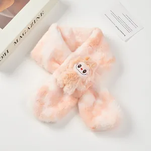 Detail of plush tie-dye kid's scarf featuring a cute cartoon monster and soft faux fur texture