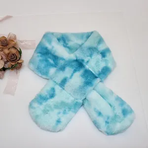 Detail view of blue and white tie-dye plush faux fur scarf for children with floral accent