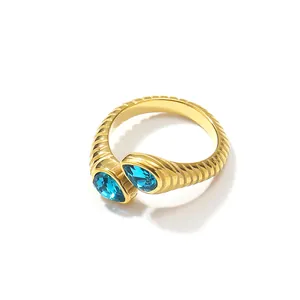 Bague croissant rétro en or 18 carats avec deux zircons bleus en forme de poire