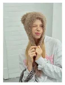 Detailed texture of light brown plush animal ear balaclava hat with cute ear details