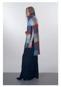 Detail of wool blend gradient plaid scarf with thick fringe and brushed texture