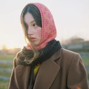 Colorful floral jacquard knitted balaclava hood for women in winter sunset setting