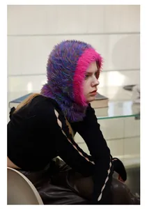 Close-up of a colorful space-dyed balaclava hat with fluffy faux fur knit texture