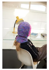 Detail of colorful long plush balaclava hood showing fluffy faux fur texture in purple and blue