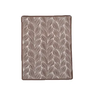Nordic leaf jacquard knit blanket in brown and white with minimalist art design