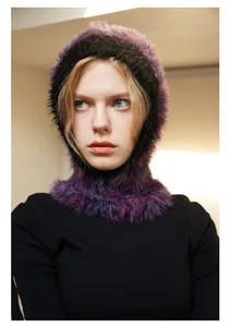 Close-up of thick purple and black faux fur balaclava showing plush texture and knit detail
