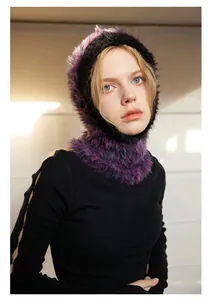 Macro detail of the fuzzy purple and black gradient faux fur texture on the balaclava
