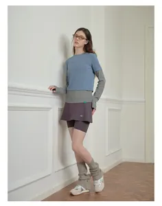Detail view of washed wool blend leg warmers styled with sneakers and activewear