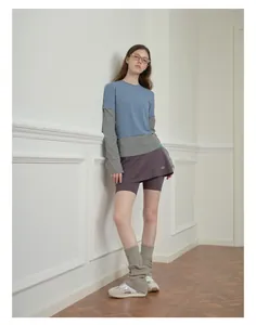 Close-up of soft wool-blend leg warmers with layered chic streetwear fashion outfit