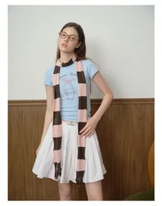 Close-up of pink and brown striped knit scarf with frayed edges for retro styling