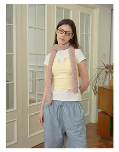 Soft pink colorful knit skinny scarf styled with vibrant pastel colored outfit and glasses