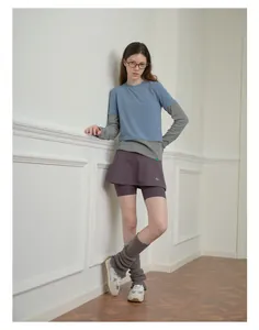 Detailed view of grey knitted leg warmers styled with subculture balletcore outfit