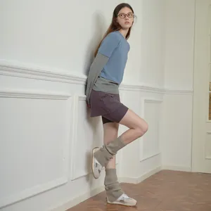 Y2K style wool blend leg warmers with vintage sneakers and purple sports skirt outfits