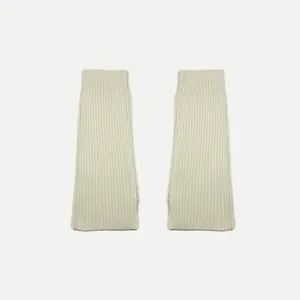 Creamy white ribbed knit leg warmers in washed wool blend with thumb hole design