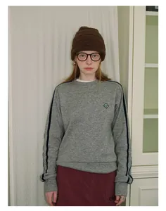 Detail showing the textured dark brown wool blend knit beanie for winter styling