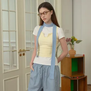 Women's casual knit vest and pants set with a matching long scarf in pastel colors