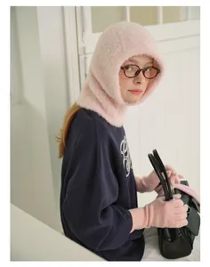 Detailed shot of pink mohair balaclava hood and matching long knit gloves set