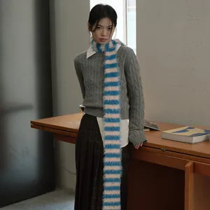 Faux mink striped scarf with millennium vintage knit style on grey cable sweater