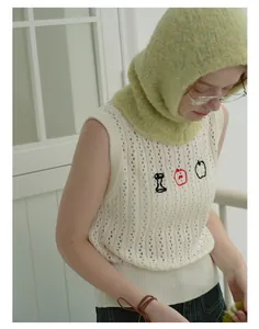 Detail of soft sage green mohair knit balaclava hood with a vintage textured finish