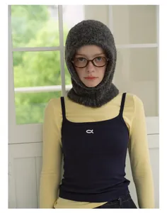 Detailed texture of dark grey wool blend knitted balaclava with cozy fuzzy finish