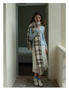 Winter wool blend scarf with brown grid pattern styled in a vintage minimalist outfit