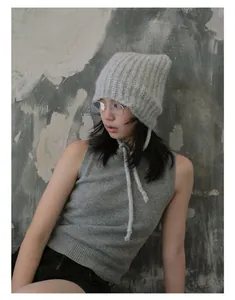 Close-up of a soft grey alpaca blend cat ear knit hat with delicate tie straps