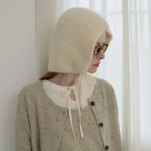 Cream white knitted balaclava hat with drawstring tie and cozy mohair texture for winter