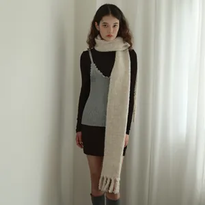 Minimalist wool blend scarf with tassels styled with autumn layering outfit in beige