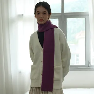 Deep purple chunky wool scarf with warm ribbed knit pattern for a winter outfit look