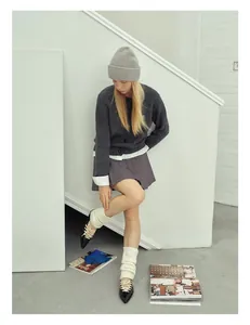 Minimalist grey sheep wool knit beanie paired with stylish preppy fashion winter outfit