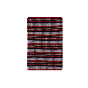 Striped wool blend leg warmers in red, black, purple, and mint green knit fabric