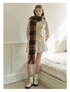Classic British plaid wool scarf with blue and brown patterns and fringed edges