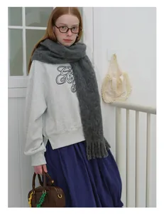 Fashionable look with thick dark grey wool scarf and purple pleated skirt for winter