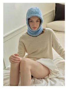 Close-up of light blue plush balaclava hood showing soft faux mink fur texture and fit
