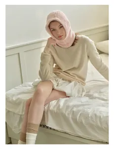 Close-up of soft pink faux mink fur balaclava showing plush texture and warmth